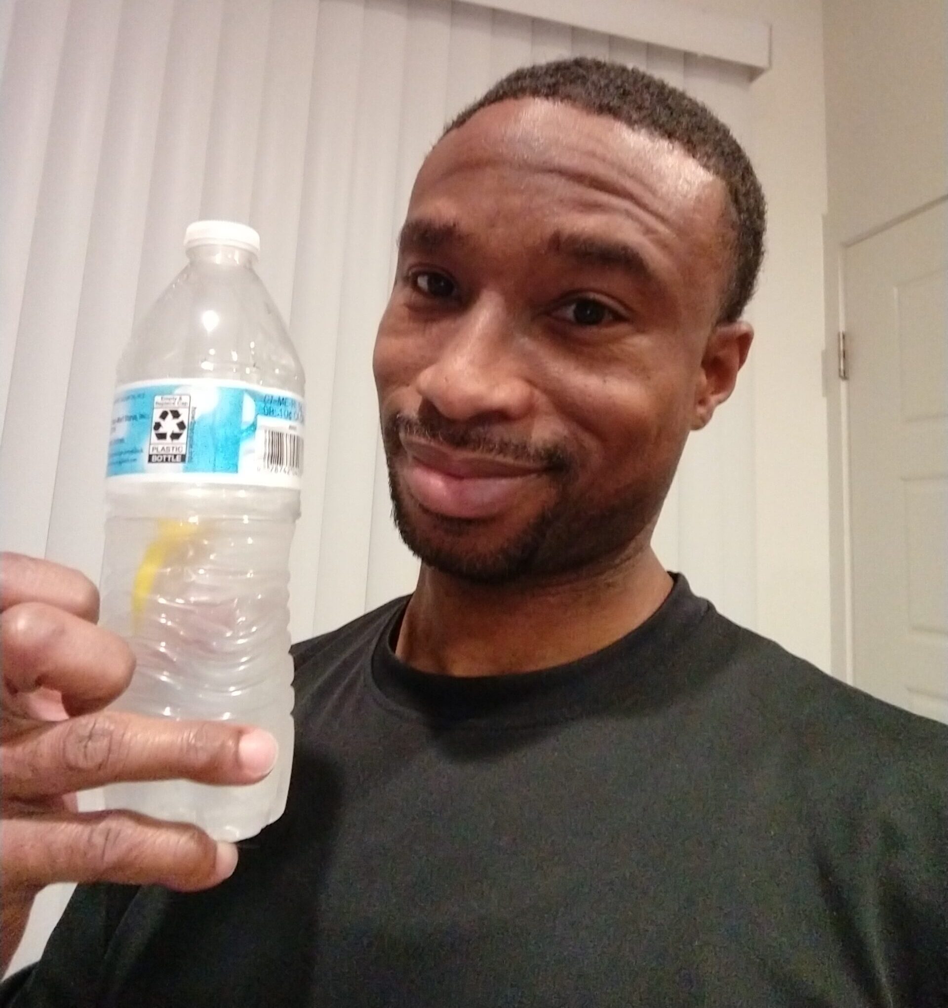 Otho Nash holding a bottle of water
