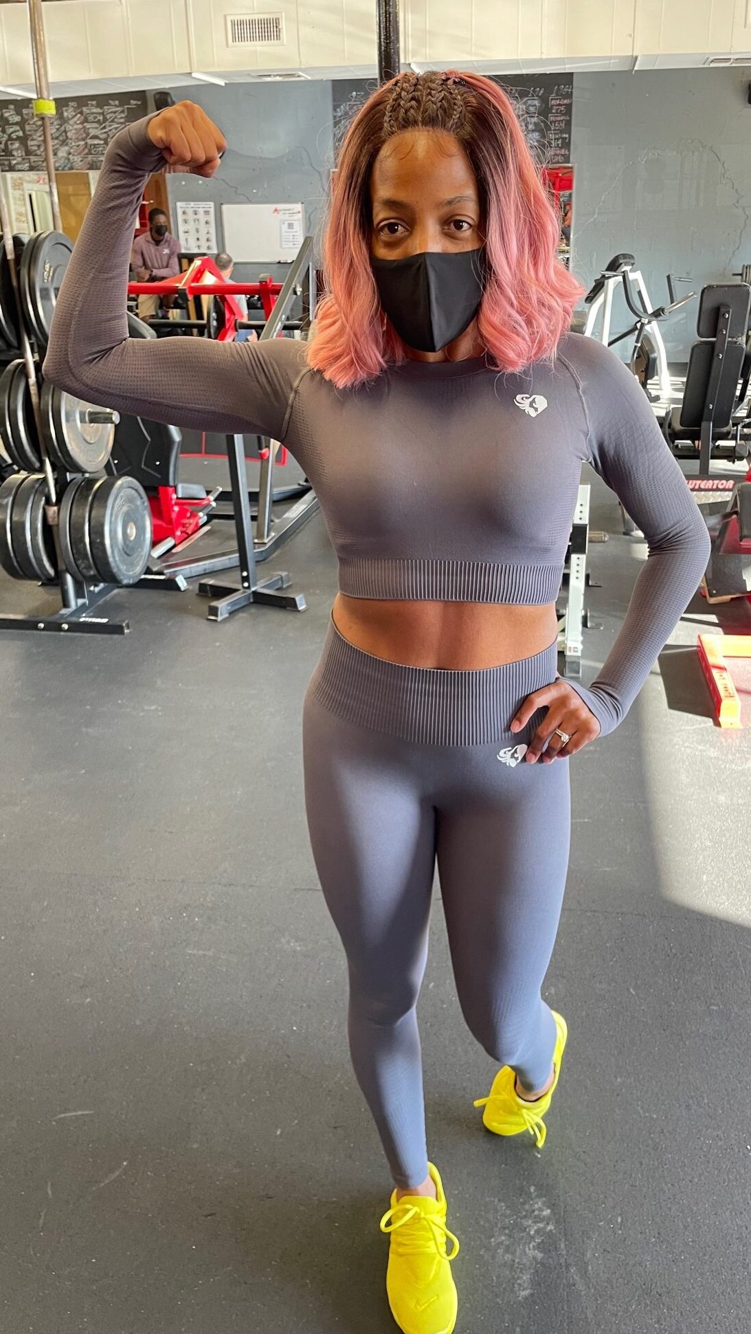 Client flexing in gym