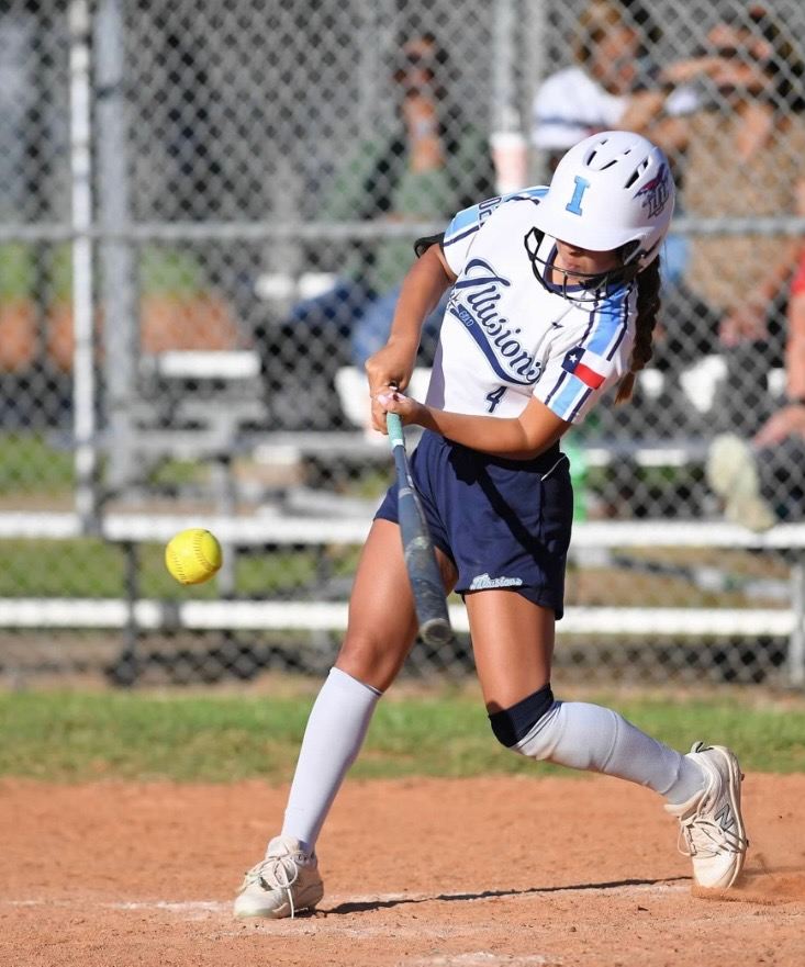 Softball player Alyssa Campos at bat