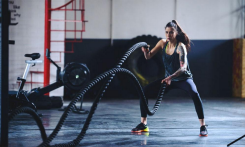 Woman using battle ropes