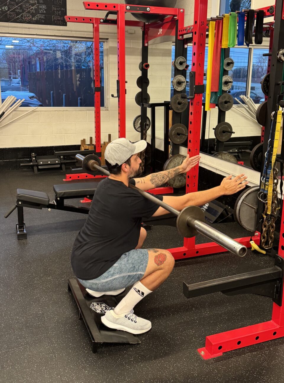 Client highlight Guhan performing a hands-free front squat with a barbell