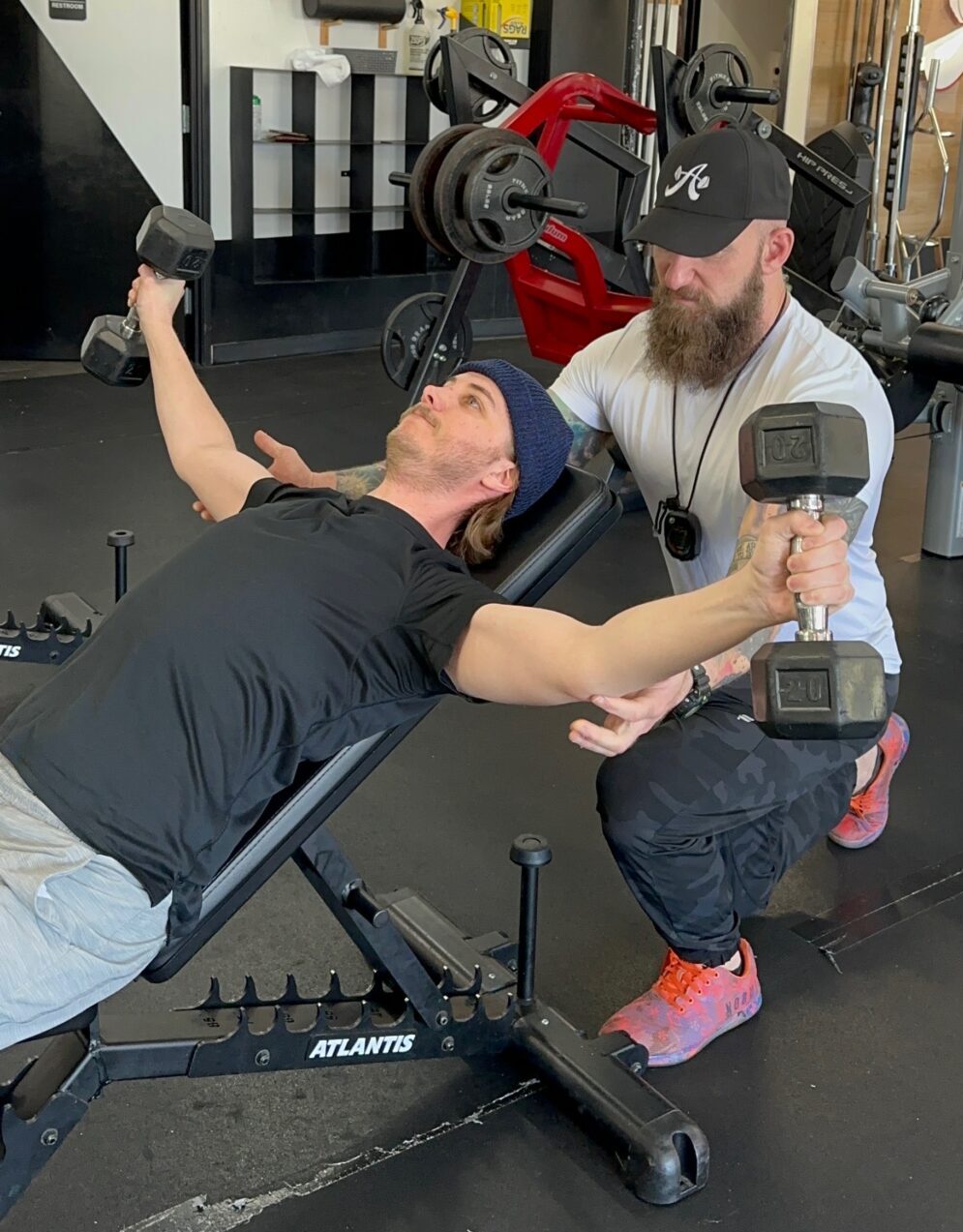 Client Highlight Nathan Franzke doing a pec flye with dumbbells