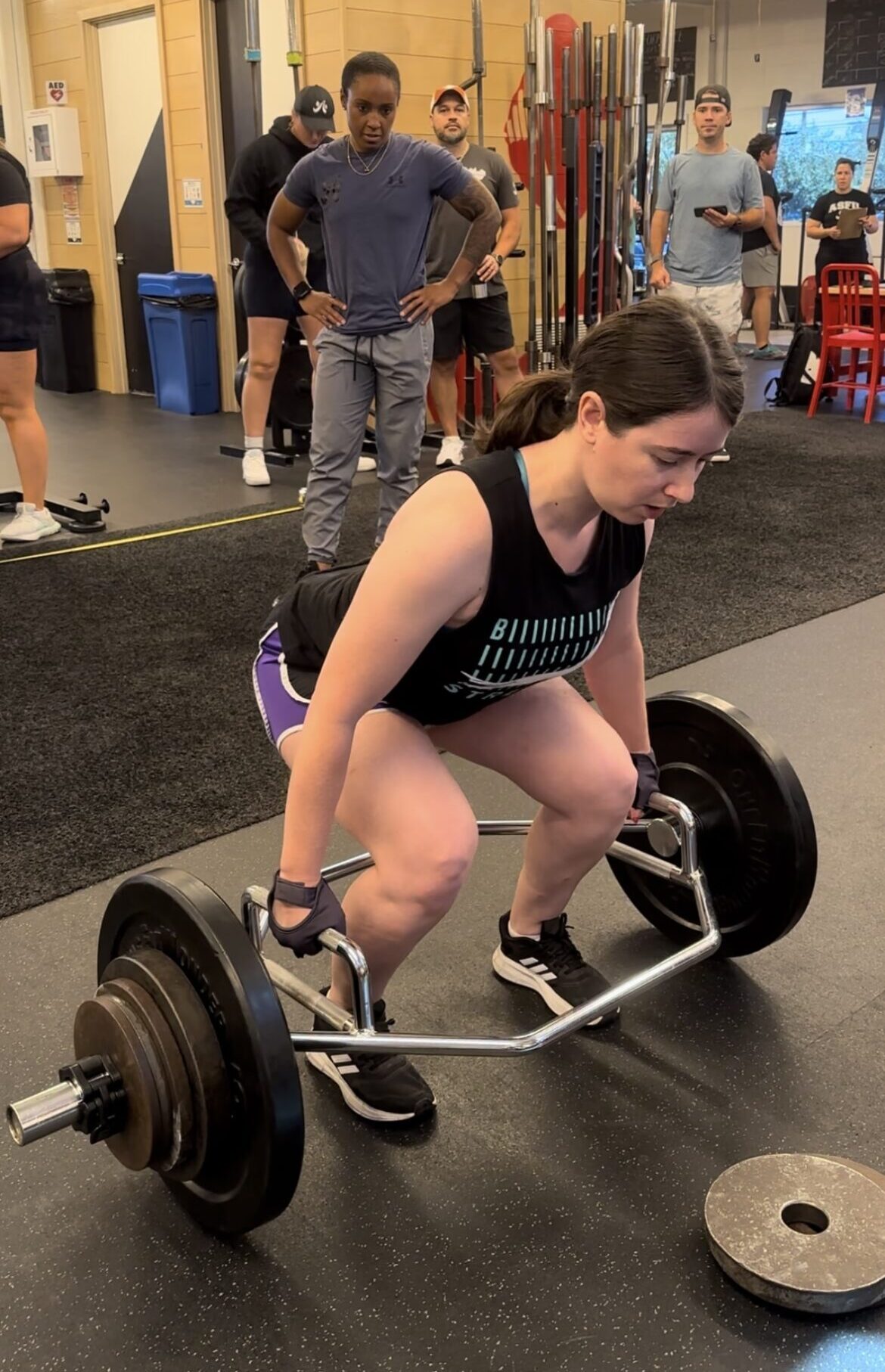 Client Highlight Melissa performing a trap bar deadlift at the Simply Fit Games 2024