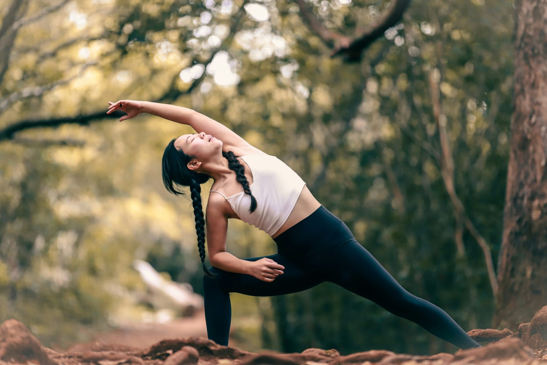 A woman stretching, part of a healthy lifestyle. Photo by Luemen Rutkowski on Unsplash