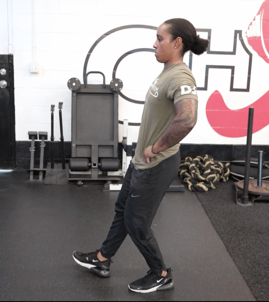 Coach Sierra doing a single leg squat test movement