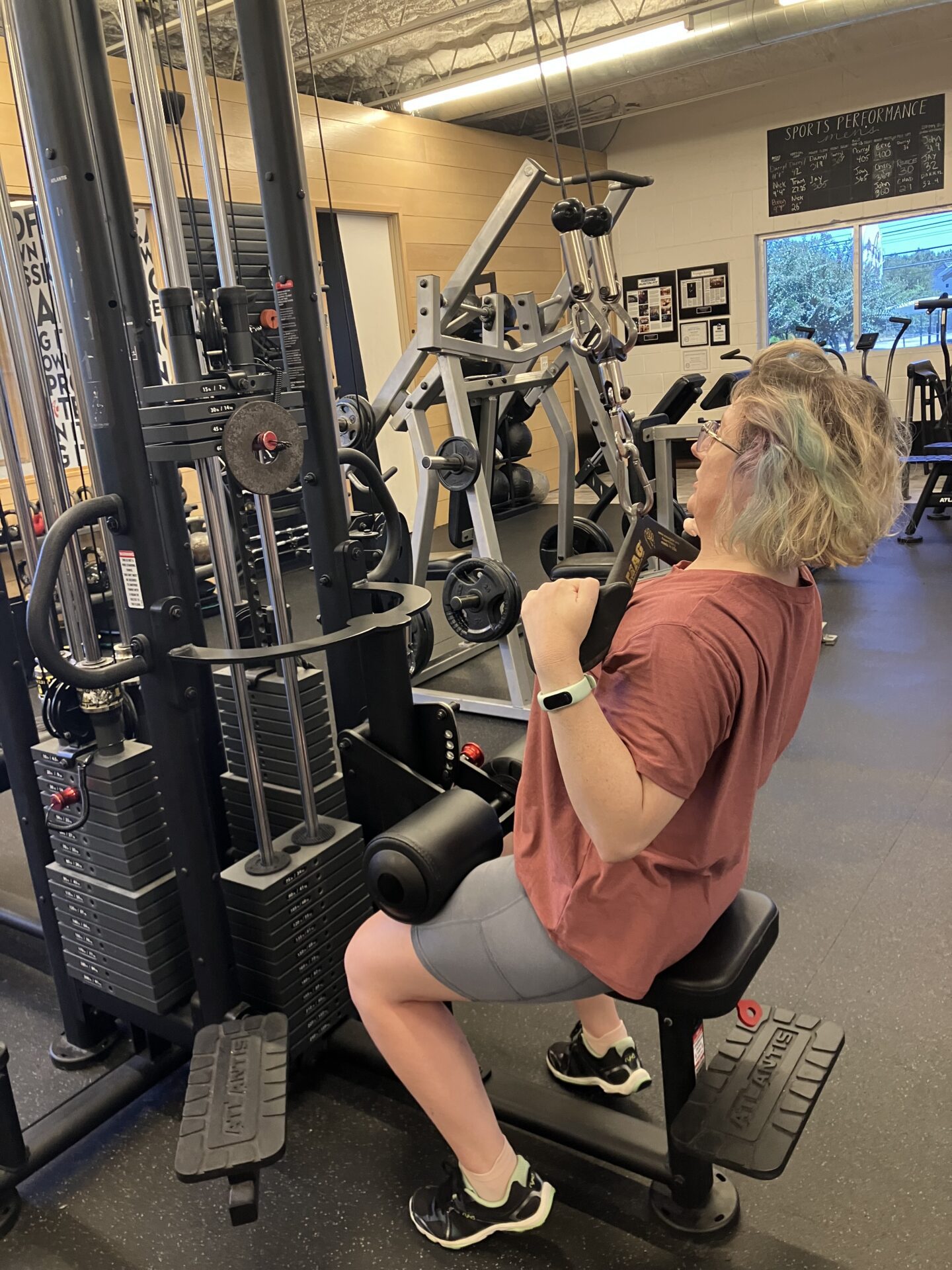 Client highlight Elizabeth performing a lat pull down